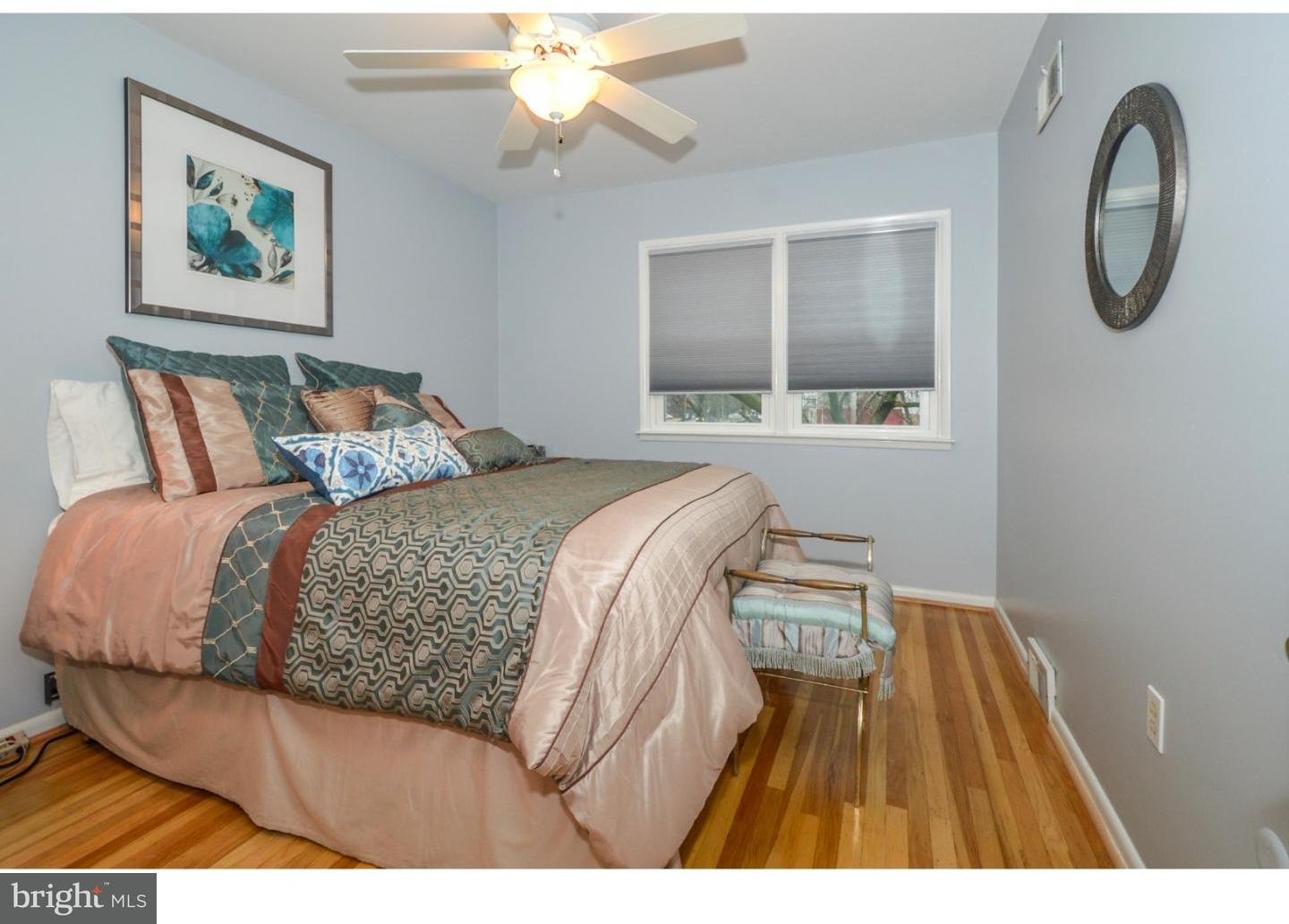 209 Radburn Road Philadelphia, PA 19115 - Photo 20 of 24 a bedroom with a bed and a painting on the wall