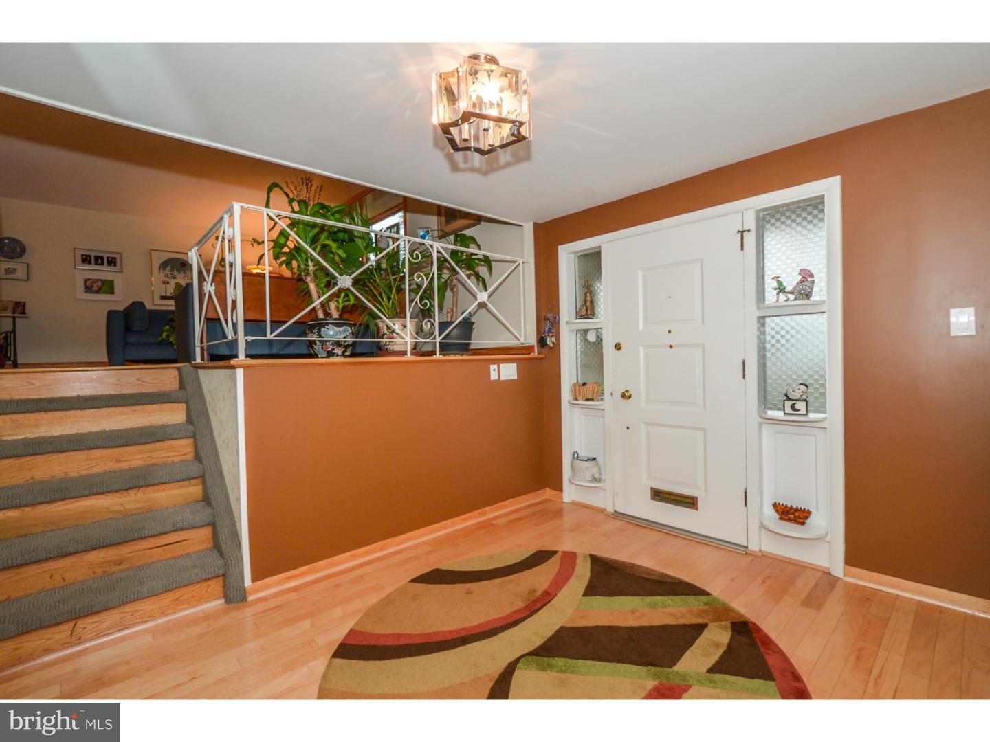 209 Radburn Road Philadelphia, PA 19115 - Photo 3 of 24 a view of a livingroom with wooden floor and a large window