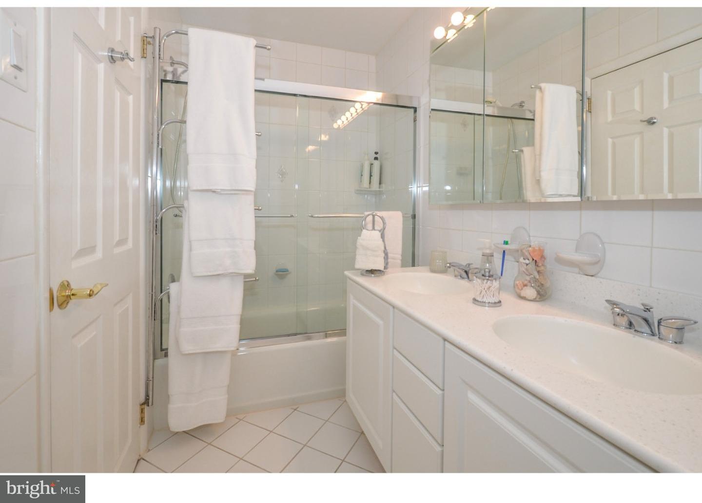209 Radburn Road Philadelphia, PA 19115 - Photo 21 of 24 a bathroom with a sink and a mirror
