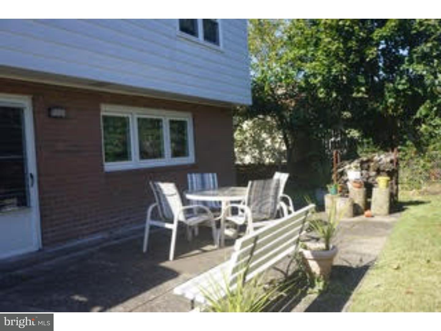 209 Radburn Road Philadelphia, PA 19115 - Photo 23 of 24 a view of a patio with table and chairs and potted plants