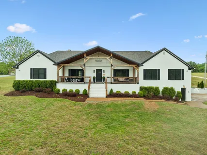 a front view of a house with a patio