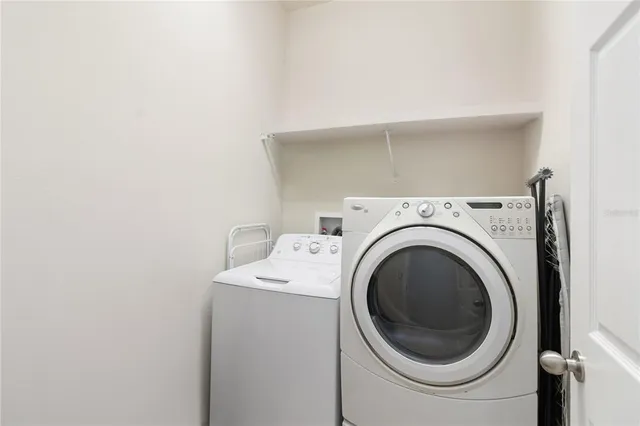 a utility room with dryer and washer