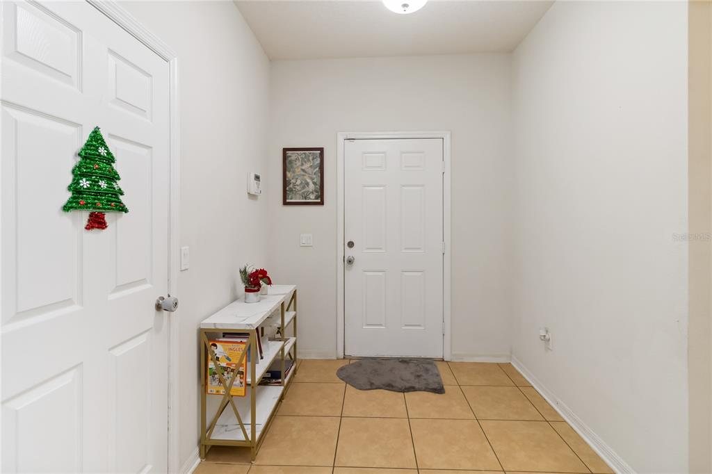 4042 Eternity Circle St. Cloud, FL 34772 - Photo 5 of 35 a room with cabinet and a rug