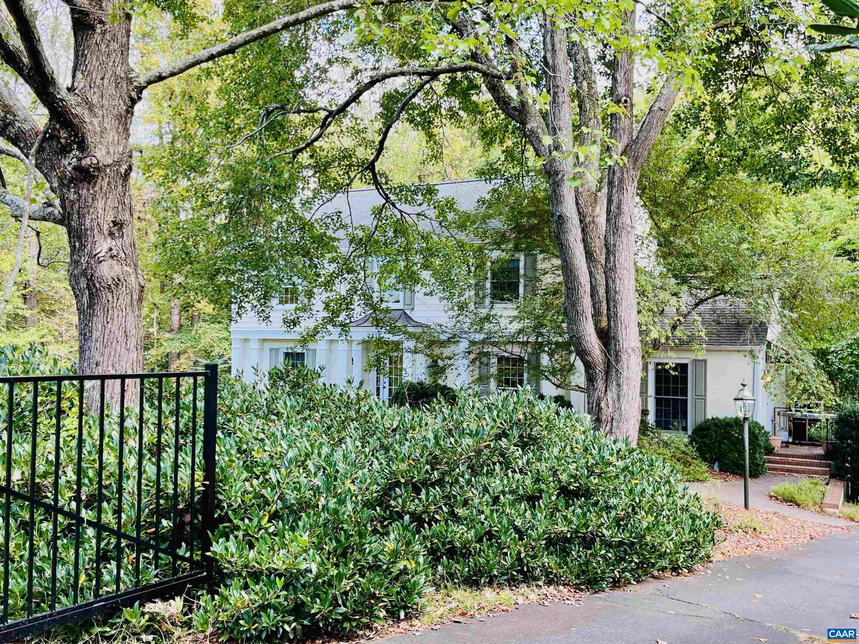 a view of a house with a tree in the background