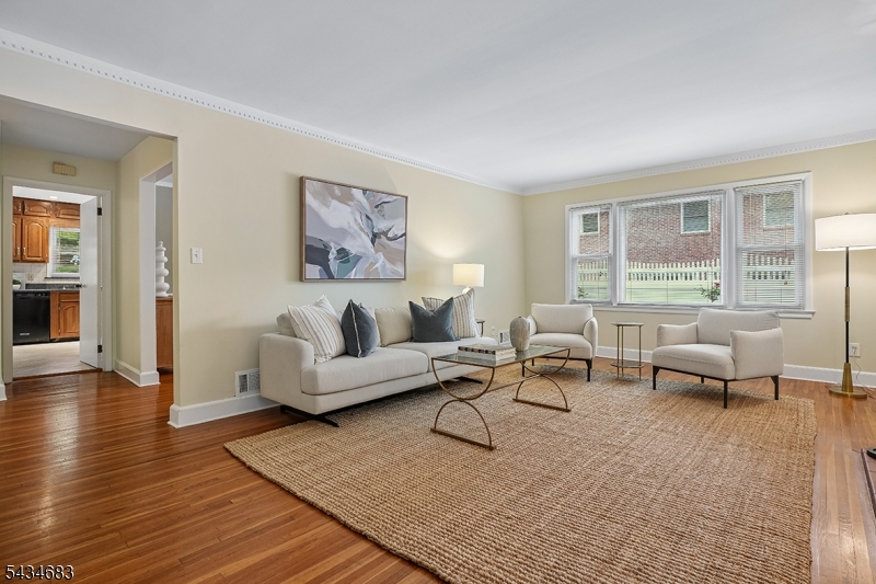 106 Division Avenue Summit, NJ 07901 - Photo 6 of 38 a living room with furniture and a large window