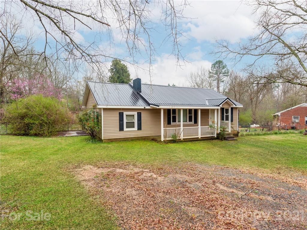 179 Harris Holly Springs Road Rutherfordton, NC 28139 - Photo 2 of 24 a view of a house with a yard
