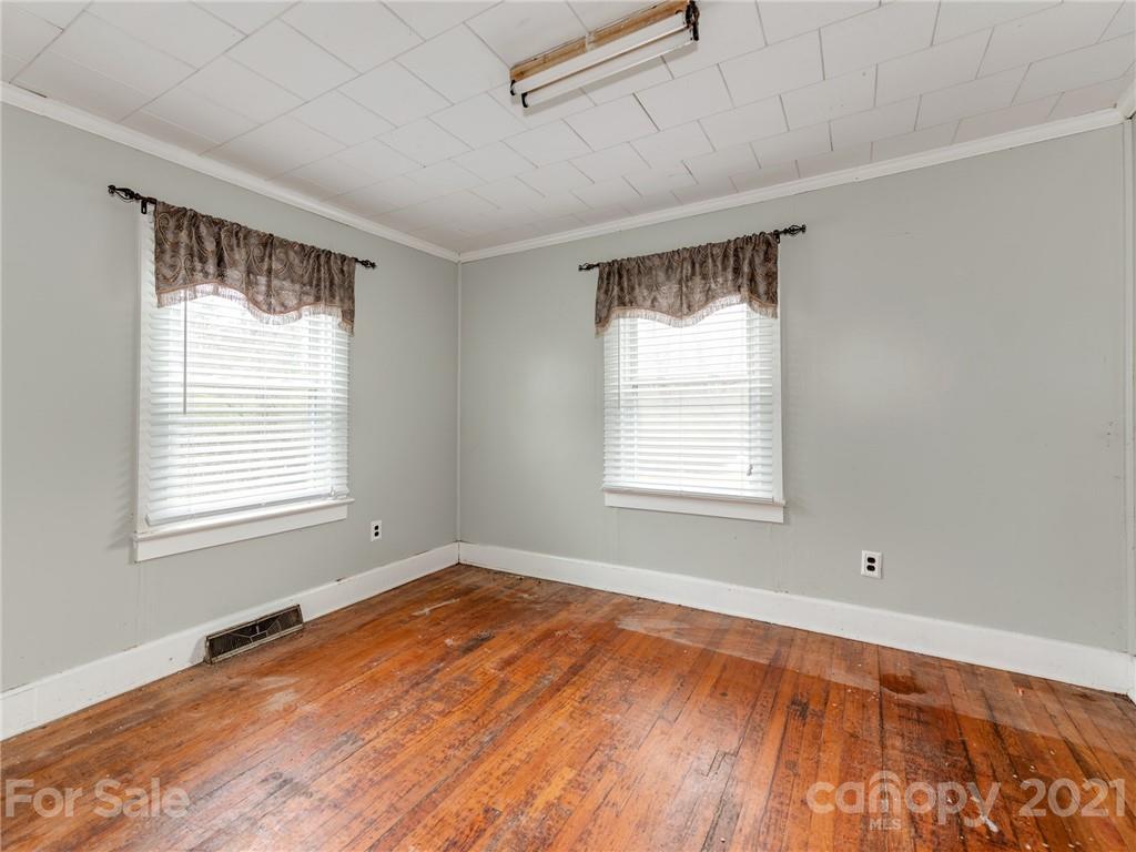 179 Harris Holly Springs Road Rutherfordton, NC 28139 - Photo 15 of 24 a view of an empty room with wooden floor and a window