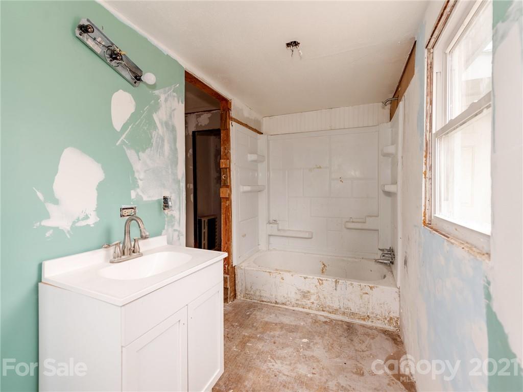 179 Harris Holly Springs Road Rutherfordton, NC 28139 - Photo 20 of 24 a bathroom with a sink and a mirror