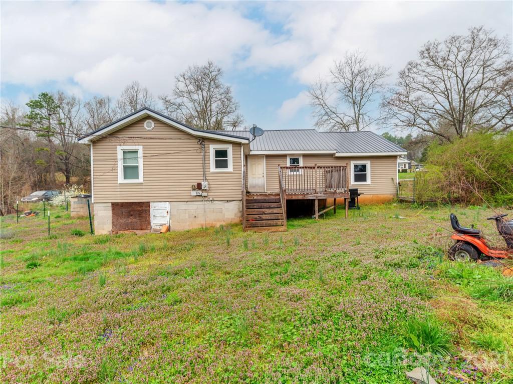 179 Harris Holly Springs Road Rutherfordton, NC 28139 - Photo 24 of 24 a front view of a house with a yard and trees