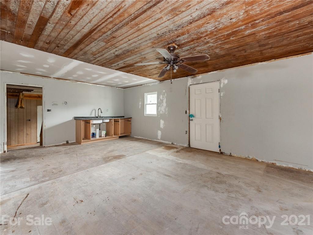 179 Harris Holly Springs Road Rutherfordton, NC 28139 - Photo 7 of 24 a view of a livingroom with a ceiling fan and window