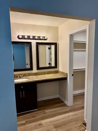 a view of living room with granite countertop furniture and a fireplace