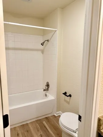 a bathroom with a sink a toilet and a bathtub