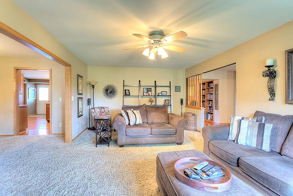 5948 Mc Donald Road Roscoe, IL 61073 - Photo 17 of 24 a living room with furniture and a chandelier