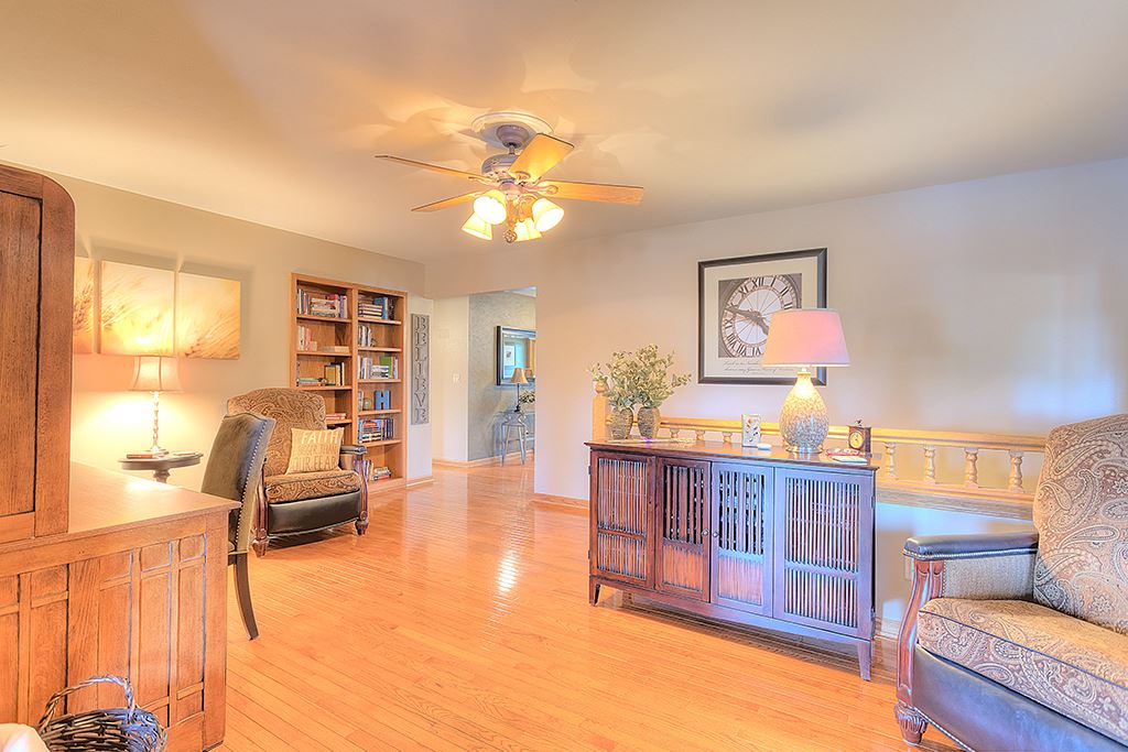 5948 Mc Donald Road Roscoe, IL 61073 - Photo 18 of 24 a living room with furniture and a wooden floor