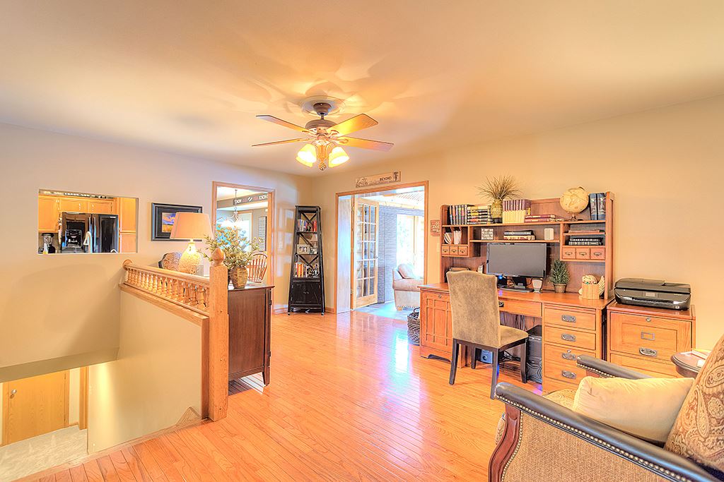 5948 Mc Donald Road Roscoe, IL 61073 - Photo 19 of 24 a living room with furniture and a flat screen tv