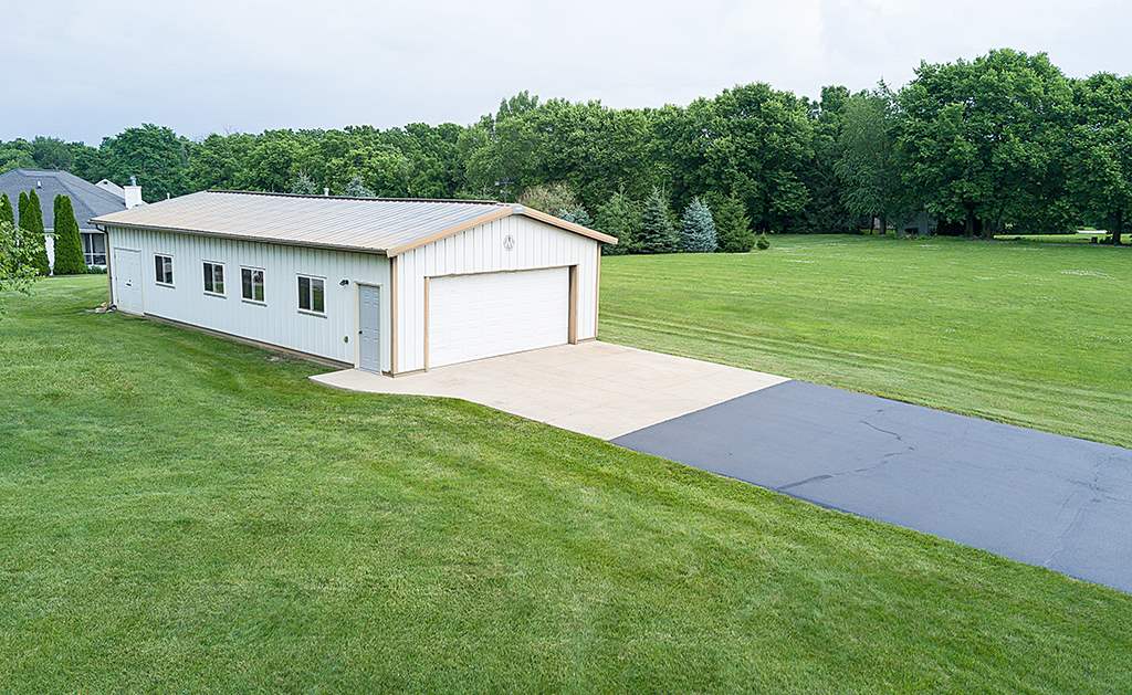 5948 Mc Donald Road Roscoe, IL 61073 - Photo 22 of 24 a view of a house with a yard