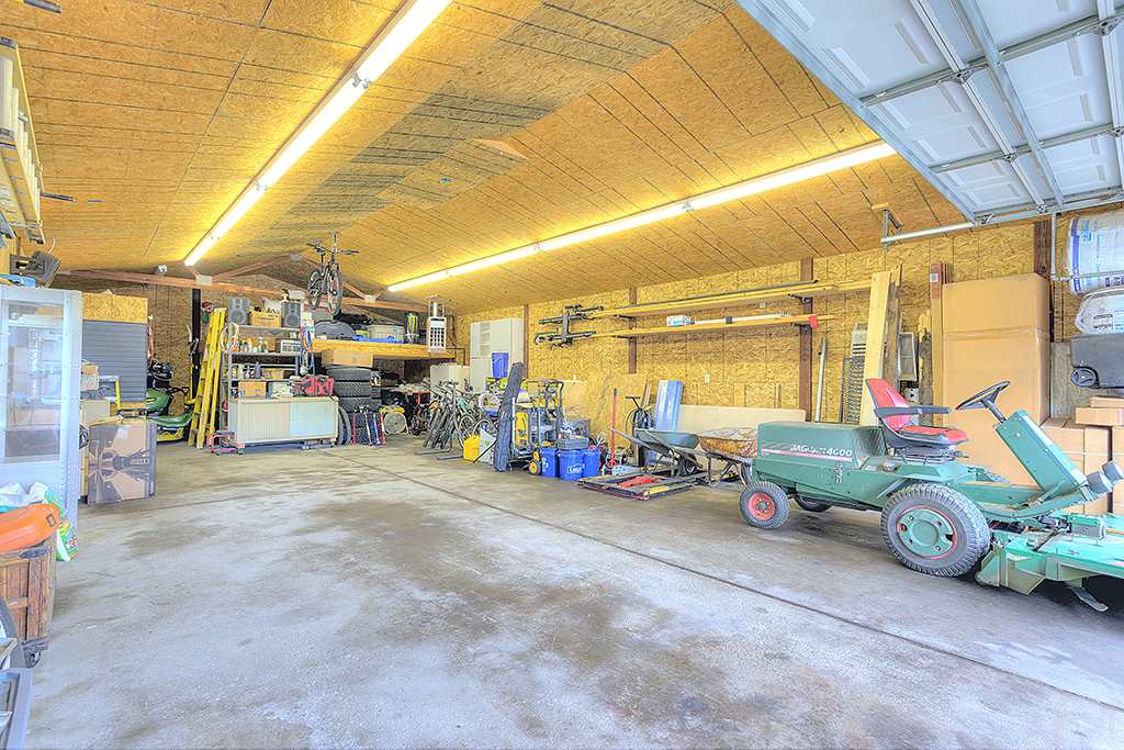 5948 Mc Donald Road Roscoe, IL 61073 - Photo 23 of 24 a view of a garage with parked cars