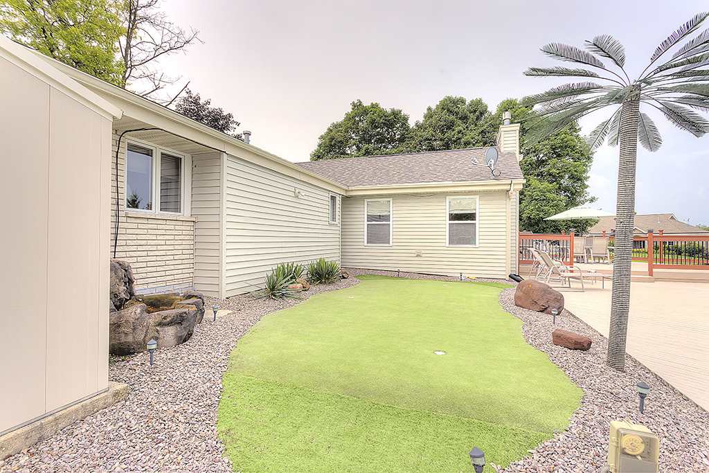 5948 Mc Donald Road Roscoe, IL 61073 - Photo 3 of 24 a backyard of a house with table and chairs