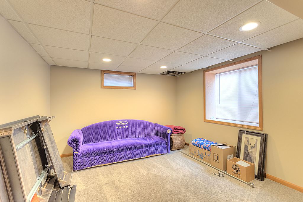 5948 Mc Donald Road Roscoe, IL 61073 - Photo 7 of 24 a bedroom with furniture and a couch