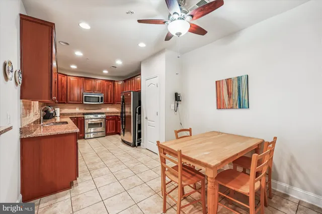 a kitchen with a table and chairs in it
