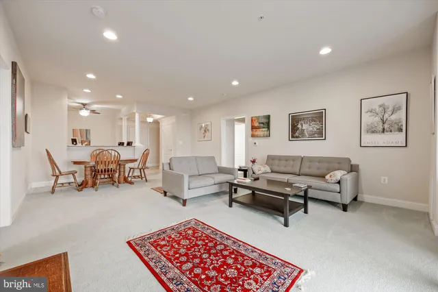 a living room with furniture and a table