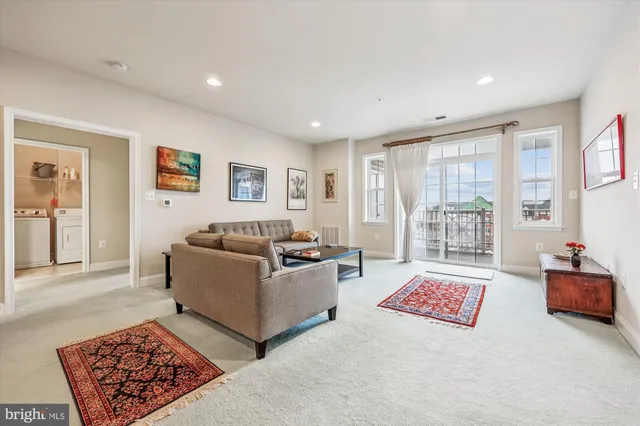 a living room with furniture and a rug