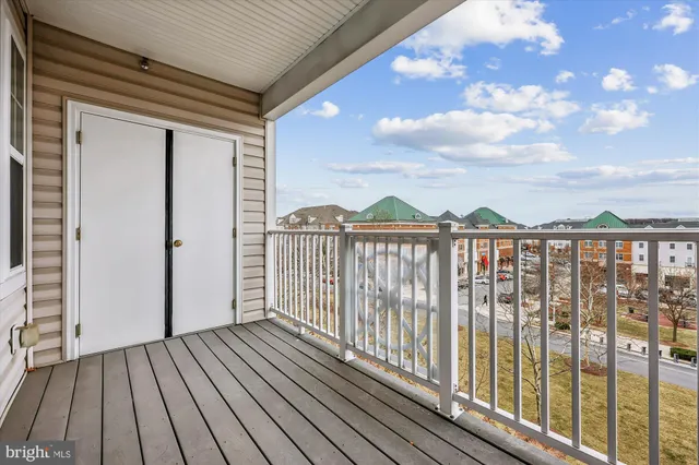 a view of a balcony with wooden floor
