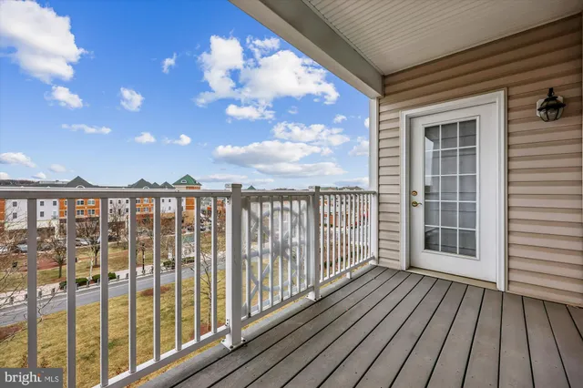a view of a balcony with wooden floor