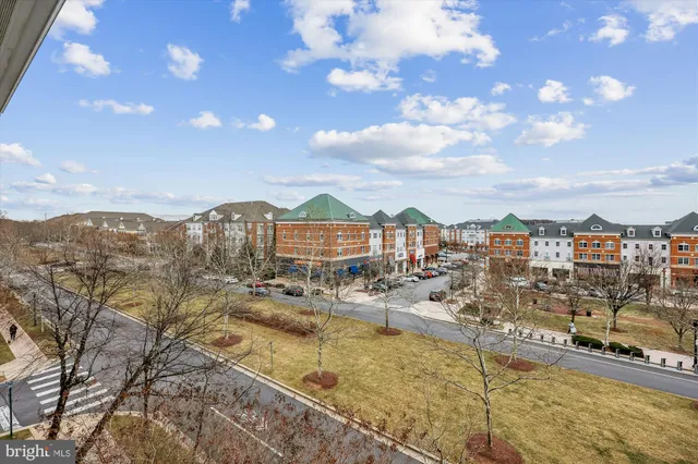 a living room with furniture a air conditioner and a window
