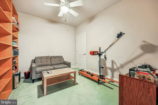 a spacious bedroom with a bed and a window