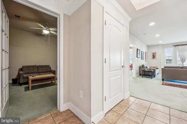 a view of a livingroom with furniture and white doors