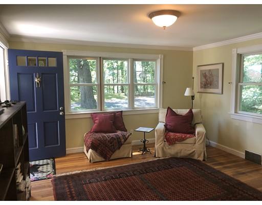 35 Beacon Street Amesbury, MA 01913 - Photo 2 of 17 a living room with furniture and a flat screen tv