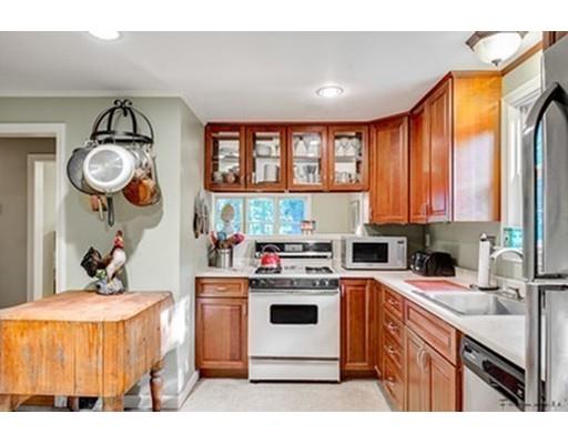 35 Beacon Street Amesbury, MA 01913 - Photo 5 of 17 a kitchen with a stove a sink and a refrigerator