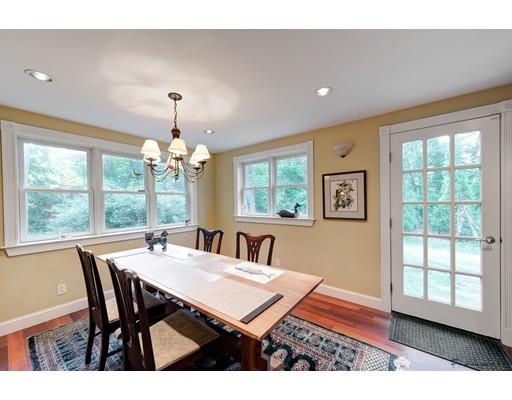 35 Beacon Street Amesbury, MA 01913 - Photo 6 of 17 a dining room with wooden floor a chandelier a wooden table and chairs