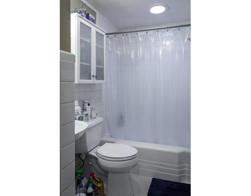 35 Beacon Street Amesbury, MA 01913 - Photo 9 of 17 a bathroom with a toilet a sink and a shower