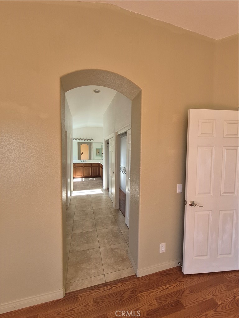28841 Tonya Street Murrieta, CA 92563 - Photo 6 of 12 a view of a room with wooden floor and a bathroom