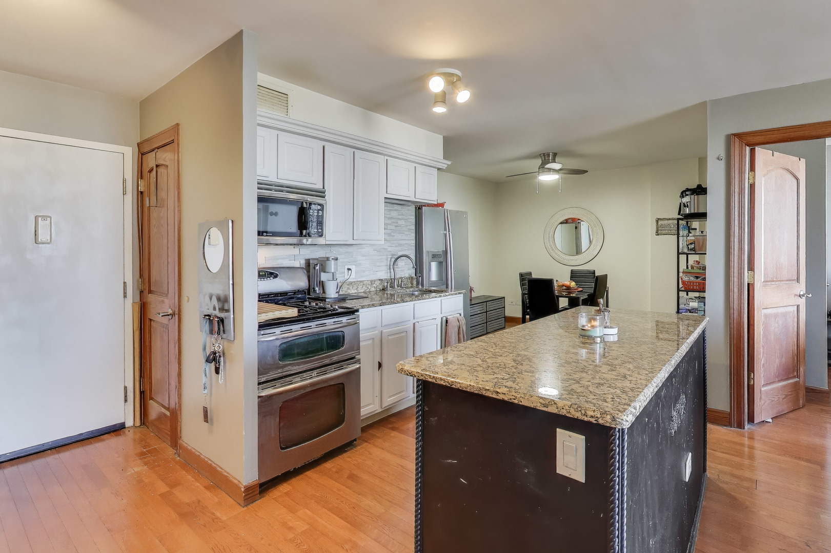 20 North Tower Road, Unit 8E Oak Brook, IL 60523 - Photo 12 of 31 a kitchen with a stove and a refrigerator