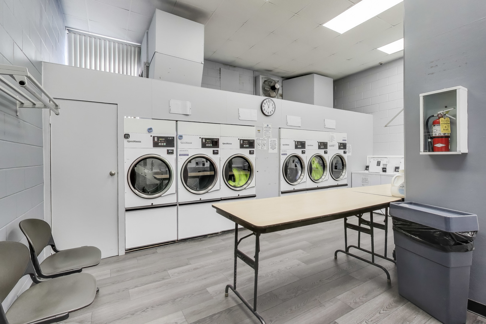 20 North Tower Road, Unit 8E Oak Brook, IL 60523 - Photo 25 of 31 a utility room with dryer washer and cabinets