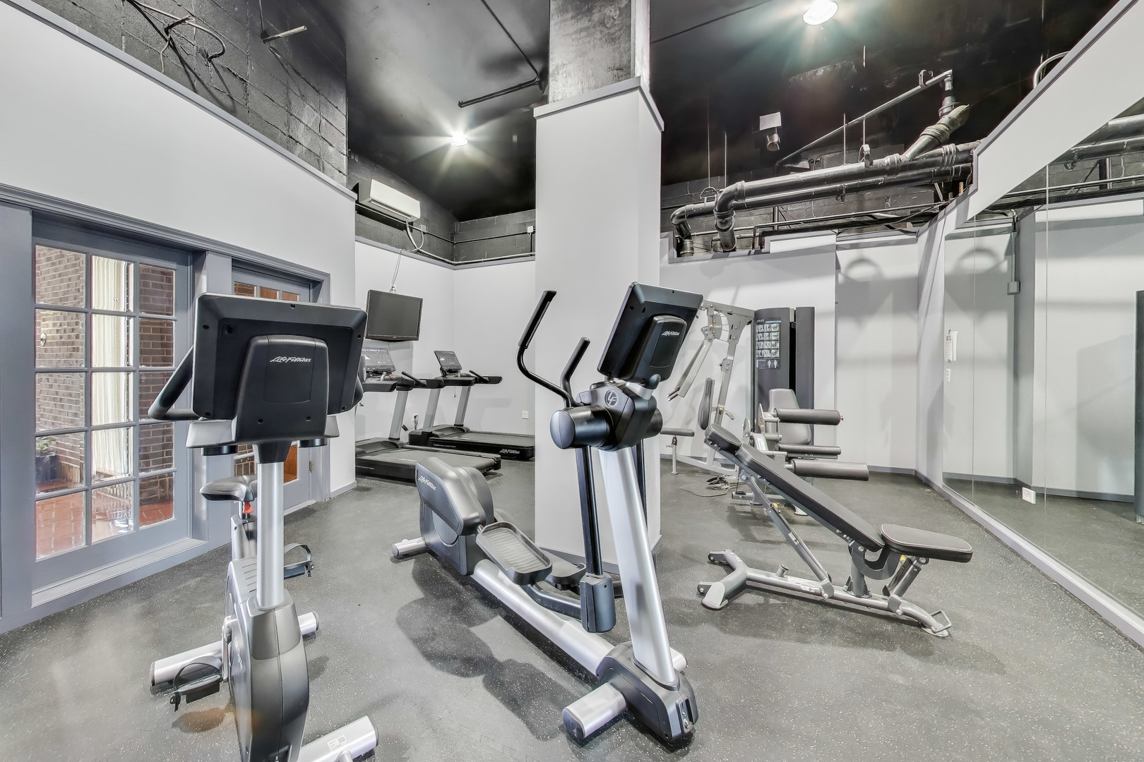 20 North Tower Road, Unit 8E Oak Brook, IL 60523 - Photo 27 of 31 a view of a room with gym equipment
