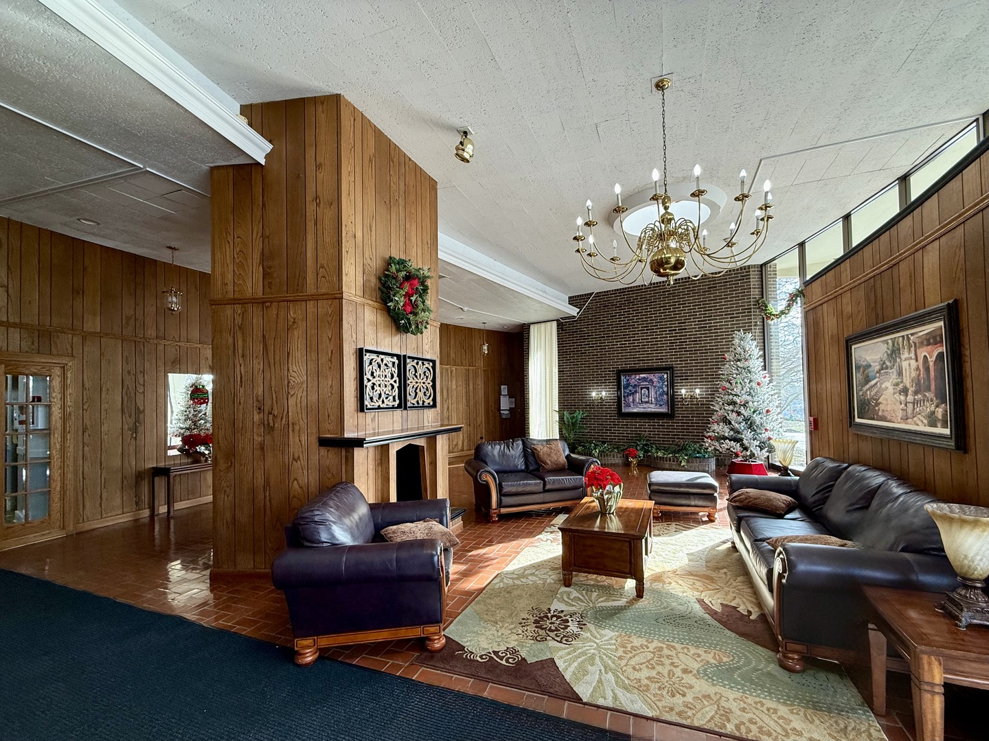 20 North Tower Road, Unit 8E Oak Brook, IL 60523 - Photo 3 of 31 a living room with fireplace furniture and a chandelier