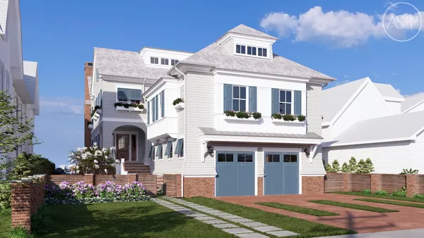 a front view of a house with a garden and trees