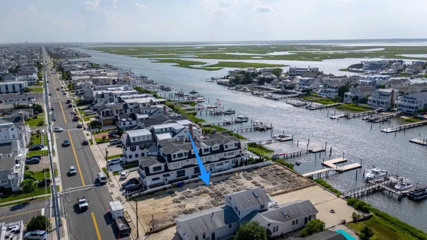 an aerial view of a house with a ocean view