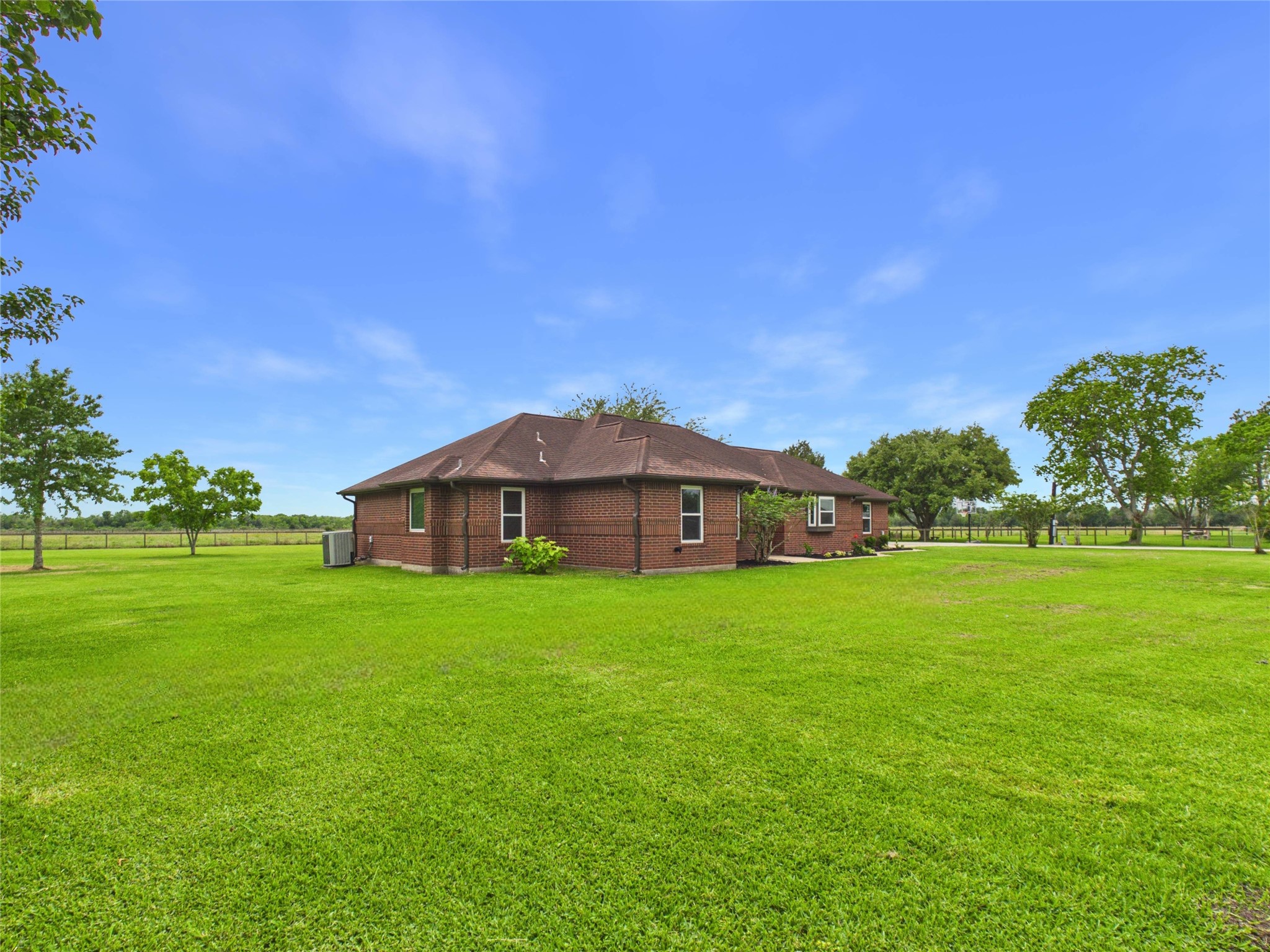 4610 Mustang Road Alvin, TX 77511 - Photo 5 of 50 Perfectly placed on the 1.5 acres. Love a great size front yard? Check! Love a large back yard? Check! Love a long, concrete driveway with plenty of parking? Check!