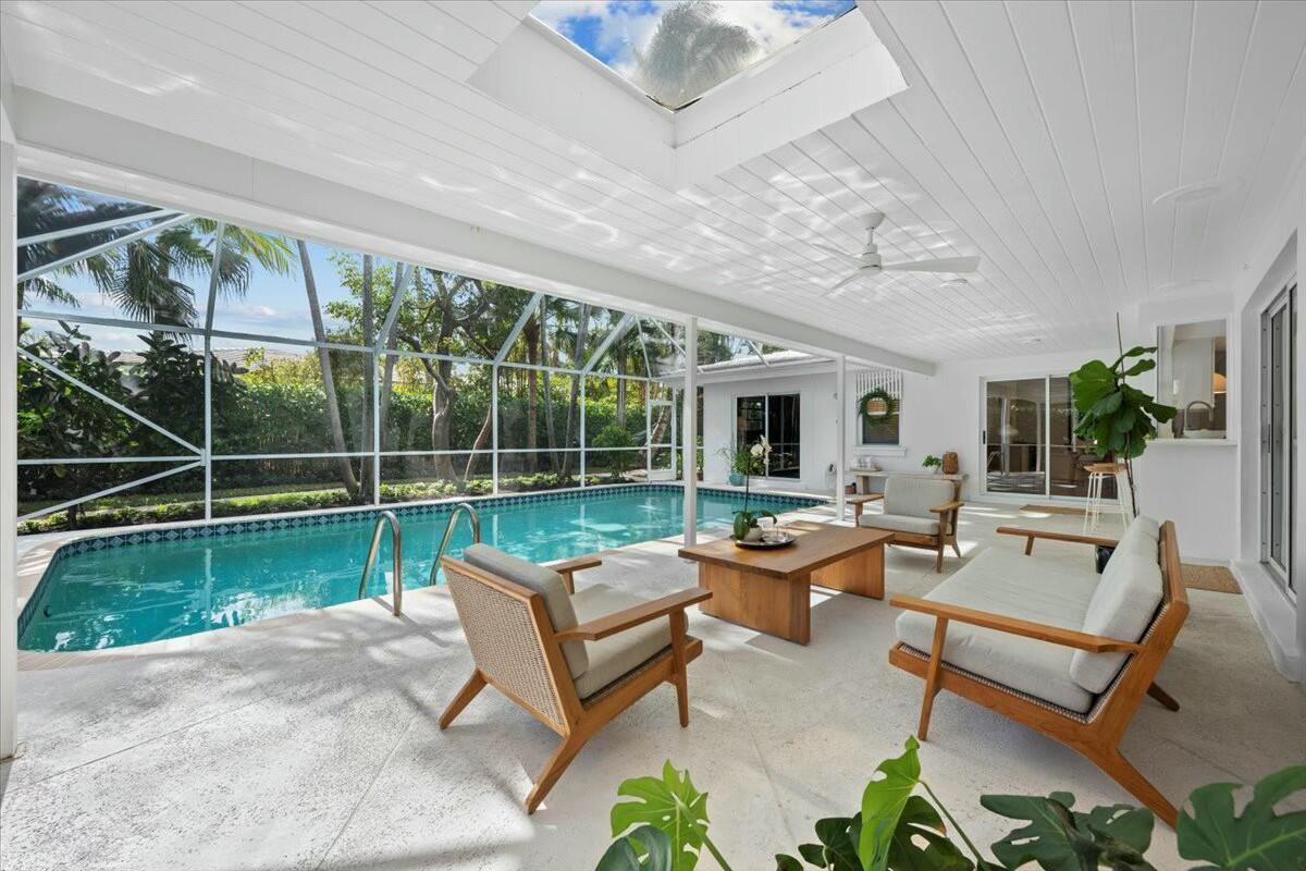 232 Cove Place Jupiter, FL 33469 - Photo 1 of 67 a view of a patio with couches chairs and potted plants