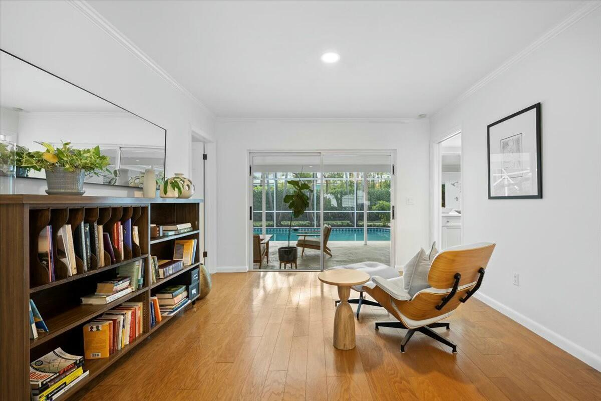 232 Cove Place Jupiter, FL 33469 - Photo 12 of 67 a living room with furniture and a book shelf