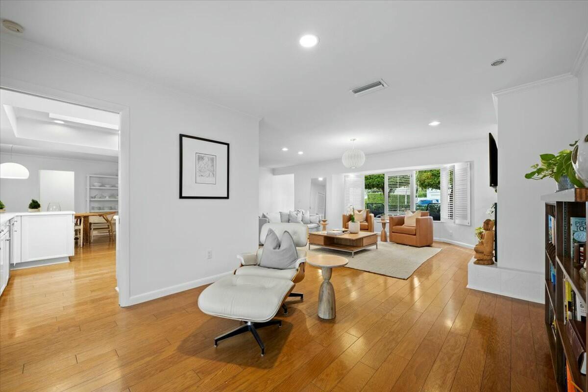 232 Cove Place Jupiter, FL 33469 - Photo 15 of 67 a living room with fireplace furniture and a wooden floor