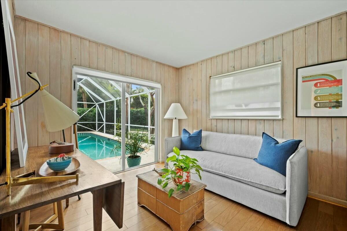 232 Cove Place Jupiter, FL 33469 - Photo 29 of 67 a living room with furniture and a large window