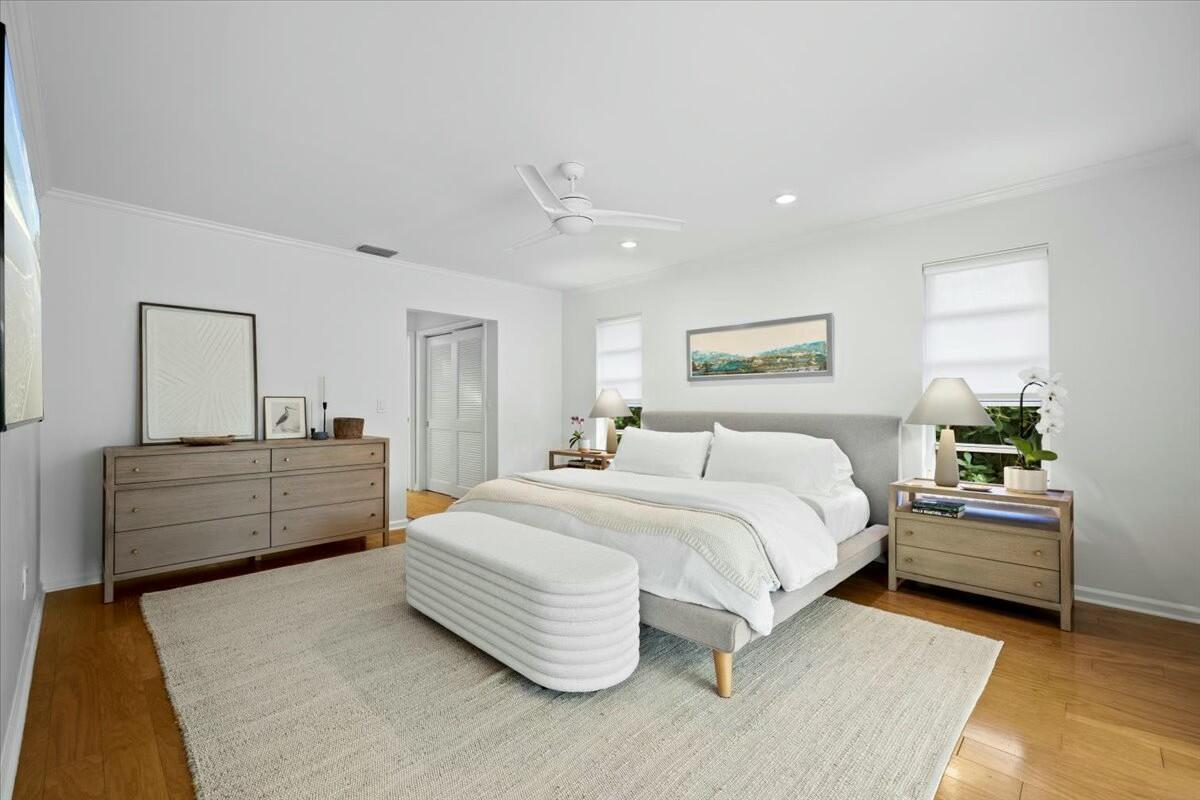 232 Cove Place Jupiter, FL 33469 - Photo 34 of 67 a bedroom with a bed and a dresser