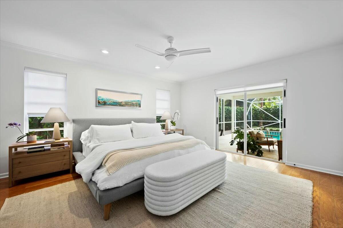 232 Cove Place Jupiter, FL 33469 - Photo 35 of 67 a bedroom with a bed and a large window