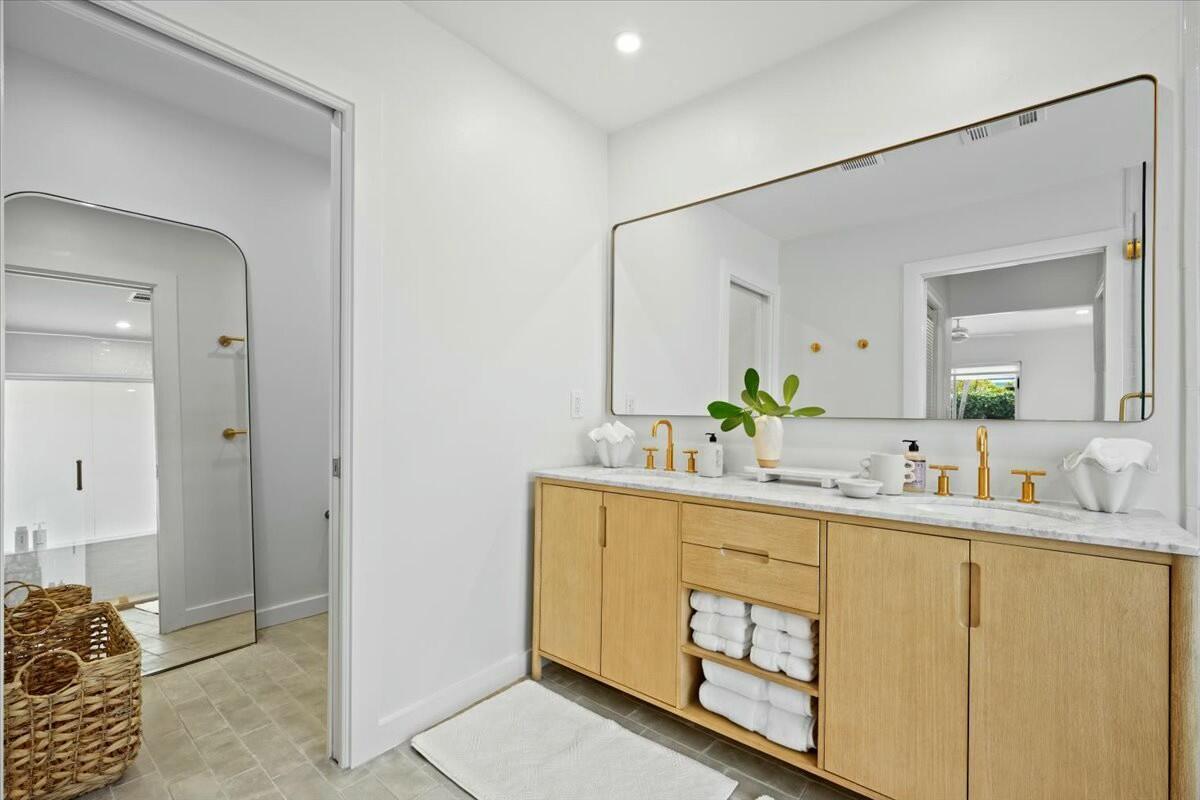 232 Cove Place Jupiter, FL 33469 - Photo 37 of 67 a bathroom with a sink and a mirror